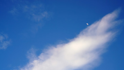 White cloud and blue sky background with copy space