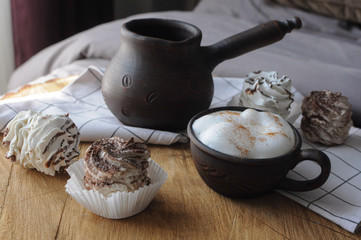 Homemade marshmallow zephyr with clay cup of coffee