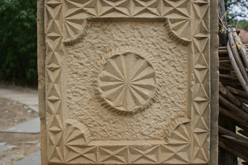 a fragment of an ornament carved in stone