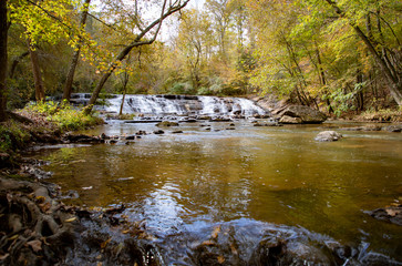 Fototapeta premium Waterfall and stream with rocks