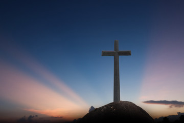 cross crucifixion jesus christ has a sunset background