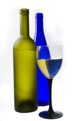 Glass of wine, two bottles and grapes on a white background.Isolated on white.