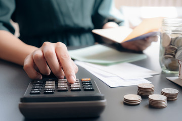 Accountant or banker calculate the cash bill.
