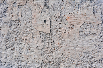 Texture of a concrete wall with cracks and scratches which can be used as a background