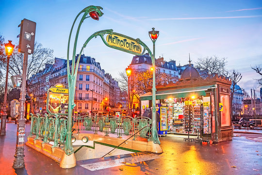 PARIS, FRANCE - DECEMBER 11,2016: Anvers - Typical Station Of The Paris Metro At Night, Exit Leads Directly To The Boulevard Pigalle, Stone's Throw From Montmartre And The Sacre-Coeur.