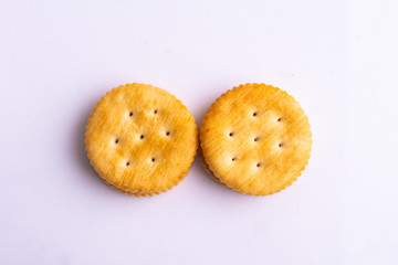 Round  crackers with salt on white background