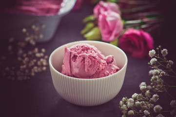 Homemade berry ice cream on rustic background