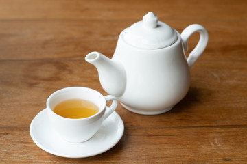 tea pot and Hot tea cup on wood table