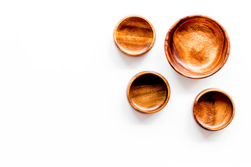 Making wooden dishes. Empty bowls on white background top view copy space