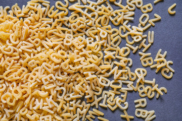 Heap of dry pasta on dark background