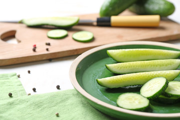 Pieces of fresh cucumbers on plate, closeup