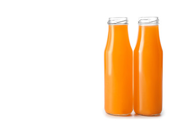 Bottles of fresh orange juice on white background