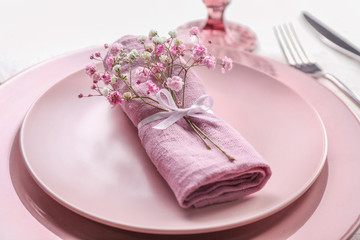 Beautiful table setting on white background, closeup
