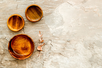 Making wooden dishes. Empty bowls on grey background top view copy space