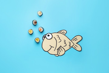 Composition with tasty sushi and drawn fish on color background