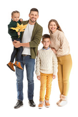 Portrait of happy family with autumn leaves on white background