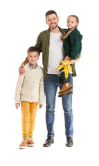 Portrait of happy family with autumn leaves on white background