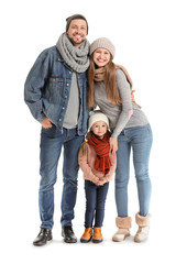 Fototapeta na wymiar Portrait of happy family in autumn clothes on white background
