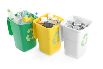 Containers with different types of garbage on white background. Recycling concept