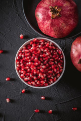 Ripe pomegranate fruits on the wooden background