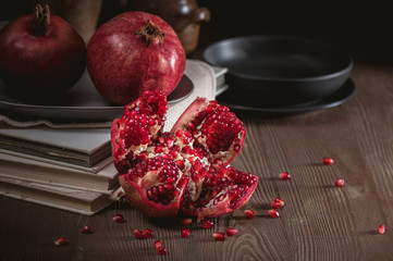Ripe pomegranate fruits on the wooden background
