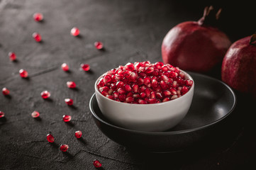Ripe pomegranate fruits on the wooden background