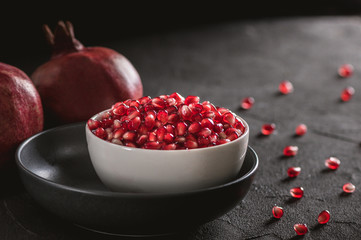 Ripe pomegranate fruits on the wooden background