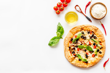 Homemade pizza on white background top view copy space
