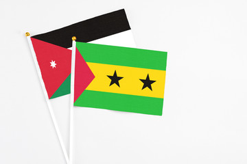 Sao Tome And Principe and Jordan stick flags on white background. High quality fabric, miniature national flag. Peaceful global concept.White floor for copy space.