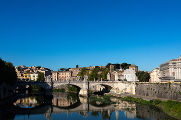 Fototapeta na wymiar View to city of Rome and Tiber from Saint Angelo bridge