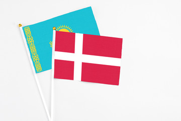 Denmark and Kazakhstan stick flags on white background. High quality fabric, miniature national flag. Peaceful global concept.White floor for copy space.