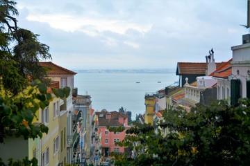 Naklejka premium Narrow street in the Lisbon city Portugal 30.Oct.2019 It is famous for its beautiful labyrinthine streets