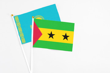 Sao Tome And Principe and Kazakhstan stick flags on white background. High quality fabric, miniature national flag. Peaceful global concept.White floor for copy space.