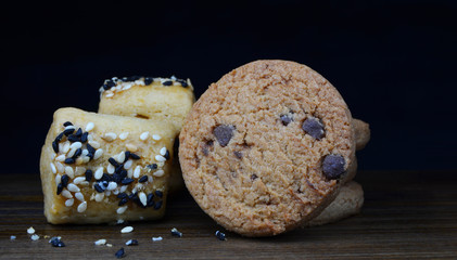 chocolate chip biscuits on black background