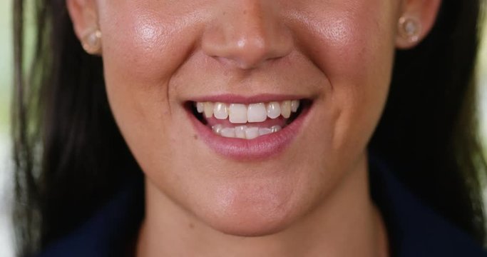 4K Extreme closeup on mouth of Hispanicwoman speaking Spanish to camera. Slow motion.