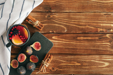 Rustic composition with glint wine and ingredients on old wooden table