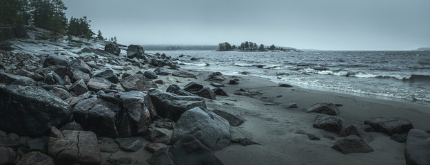 Panorama of a rocky shore. Overcast day. Background for travel materials - Powered by Adobe