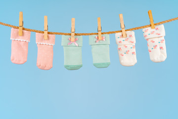 Baby socks on a clothesline. Baby clothes washing