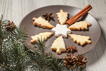 Gingerbread cookies in Christmas tree and star shape on plate