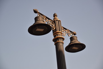 old street lamp on blue sky