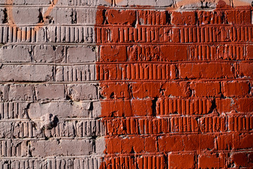 Weathered old brick wall painted brown paint. Abstract background