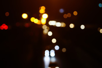 Abstract bokeh photo crated from bridge of street	