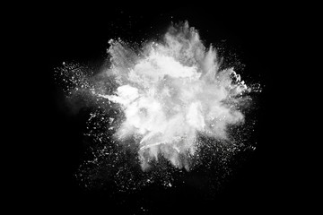 White powder explosion on black background. Colored cloud. Colorful dust explode. Paint Holi.