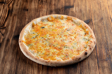 Hot four cheese pizza with melted mozzarella, cheddar, parmesan and blue cheese