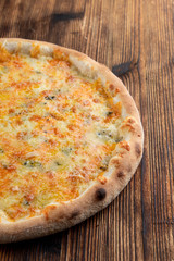 Hot four cheese pizza with melted mozzarella, cheddar, parmesan and blue cheese