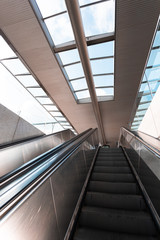 Obraz premium The escalator rises up the street