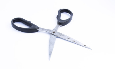 tailor metal sewing scissors with black big and small rings on a white background isolated with shadow