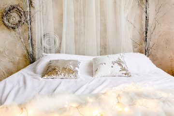 New Year design interior of beautiful bedroom in gray tones. Traditional winter holidays Christmas / New Year.