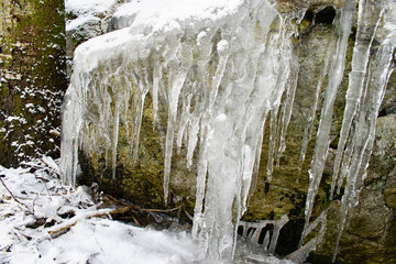 Frozen waterfall in forest
