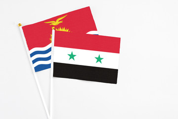 Syria and Kiribati stick flags on white background. High quality fabric, miniature national flag....